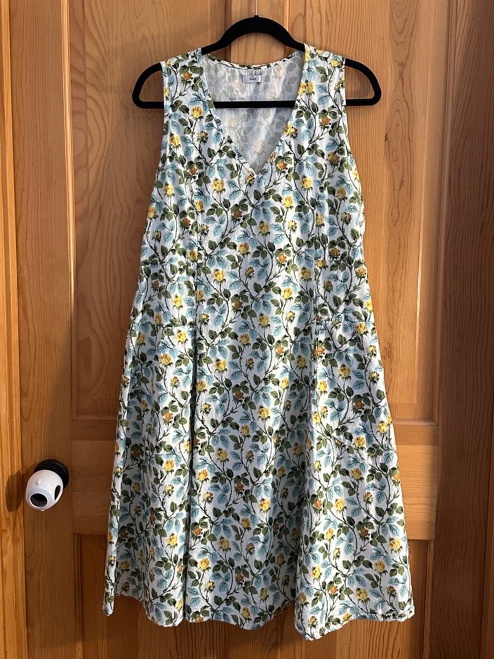 Tulip - Sleeveless Floral V-Neck Midi Dress in White with Yellow & Green.